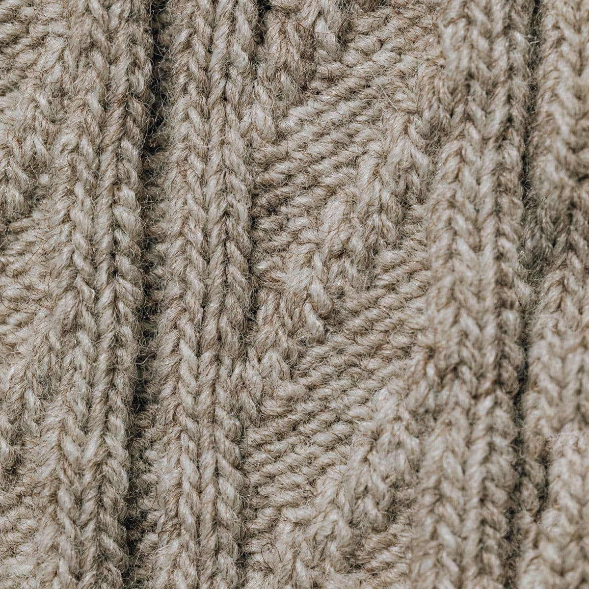 Oatmeal cable-knit fabric texture