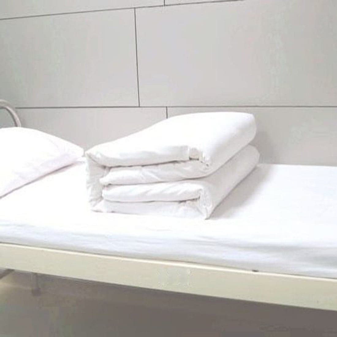 A neatly folded stack of crisp white sheets