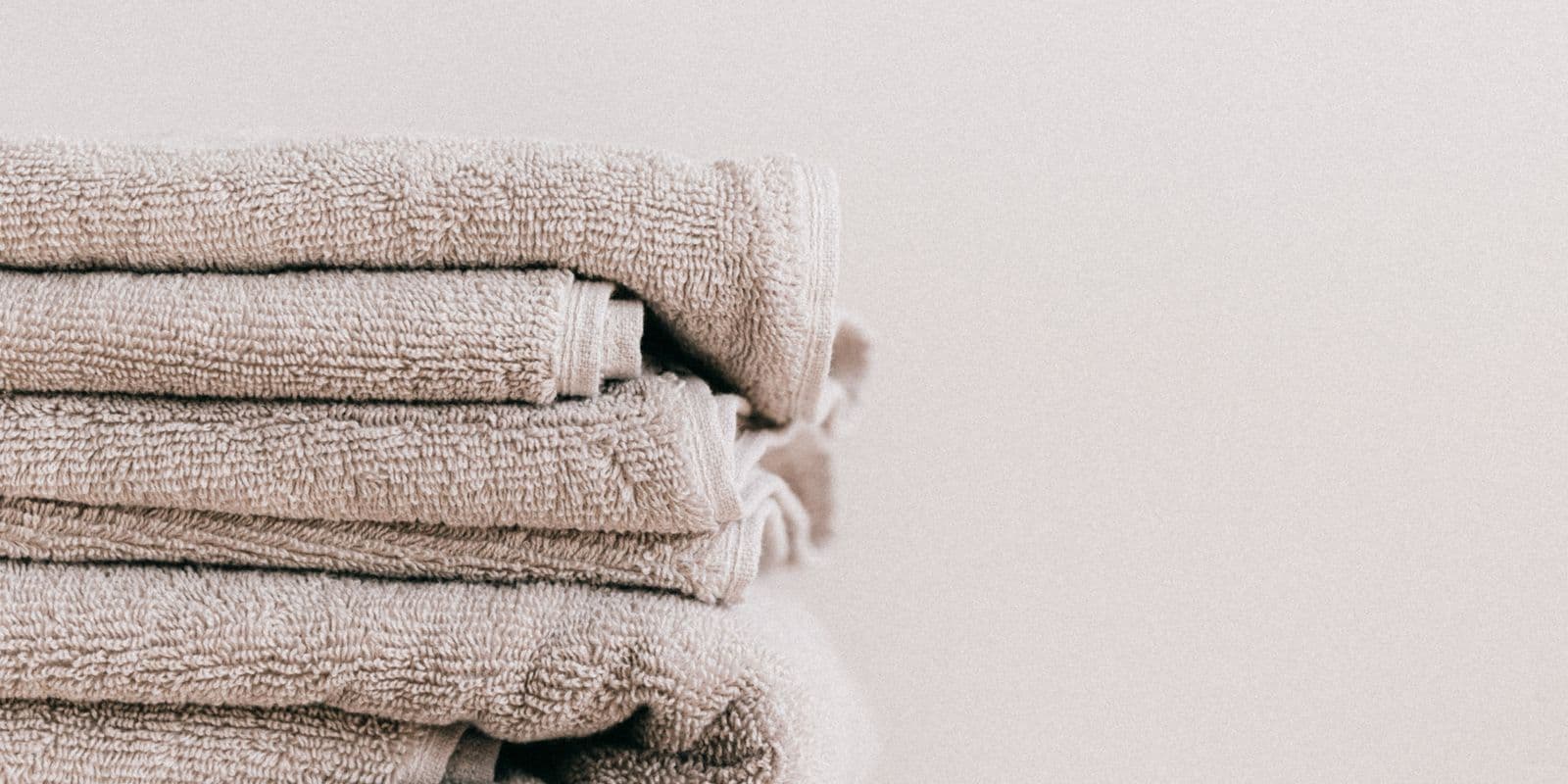 A stack of folded stone-neutral towels