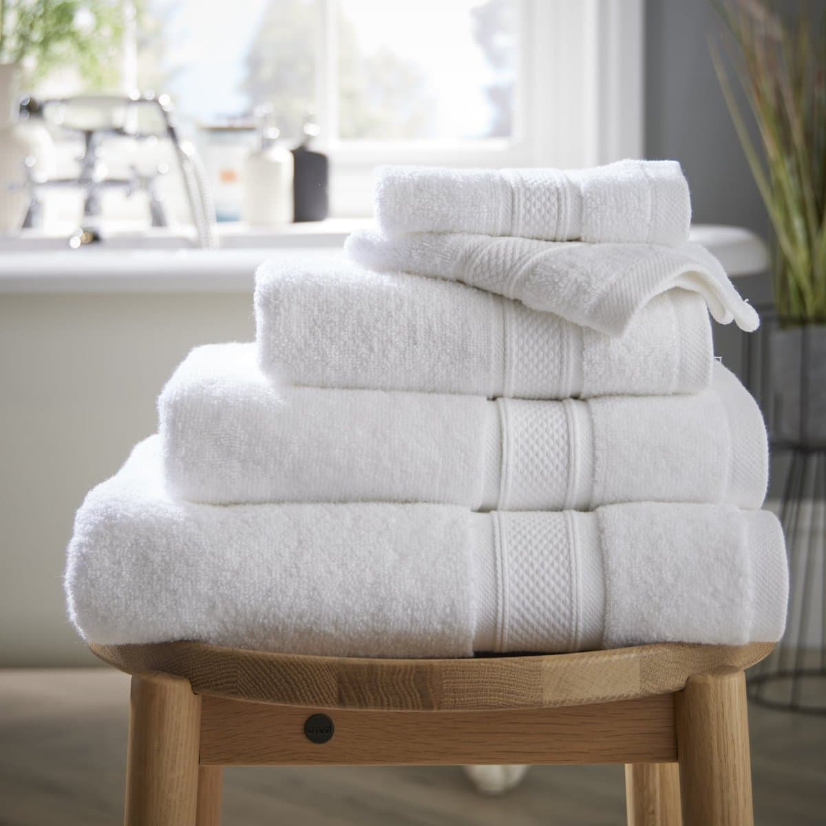 A folded set of white cotton towels