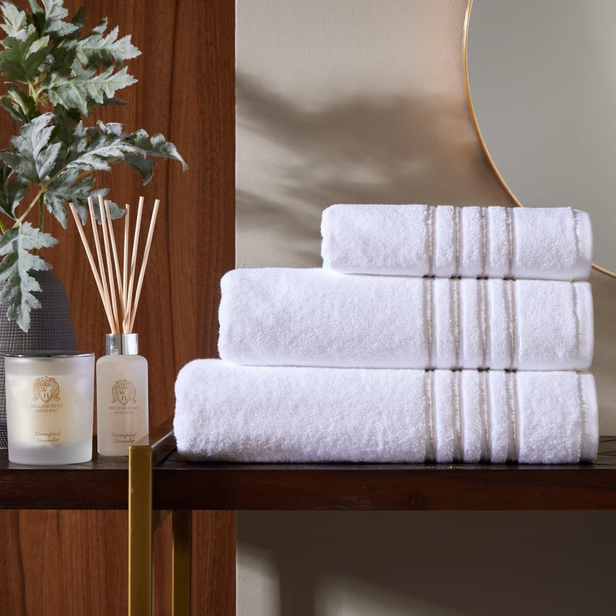 White towels with a taupe woven trim