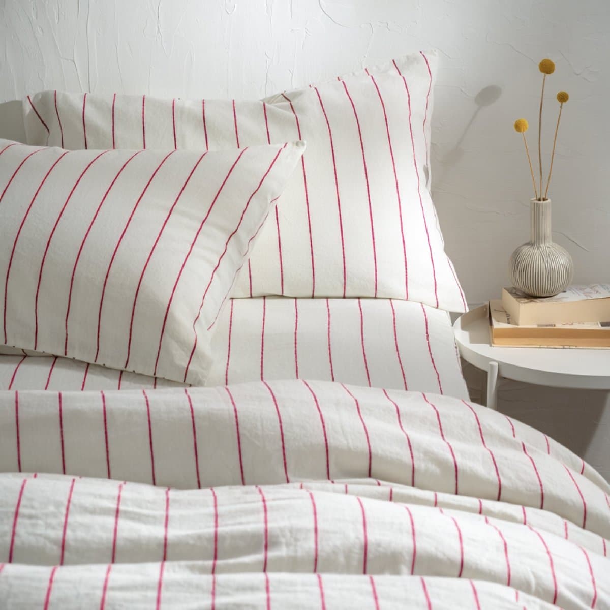 A white striped cotton pillowcase
